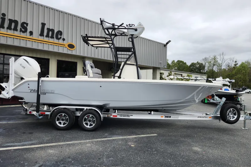 The Image of 2026 Pathfinder 2400 Open boat on trailer outside a building, side view. - 0