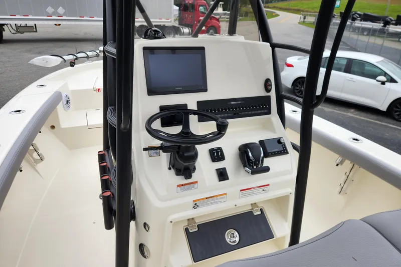 Slide: The Image of 2026 Pathfinder 2400 Open boat console with steering wheel and navigation display. - 10