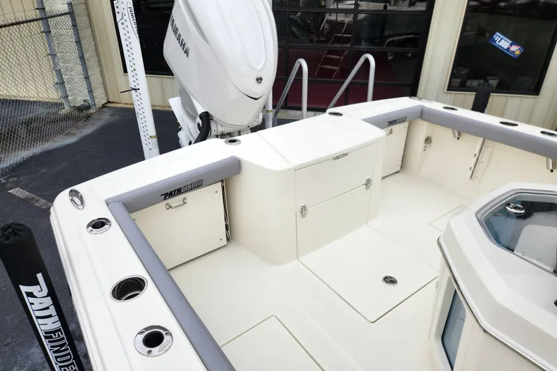 Slide: The Image of 2026 Pathfinder 2400 Open boat interior with Yamaha engine, featuring storage and seating. - 15