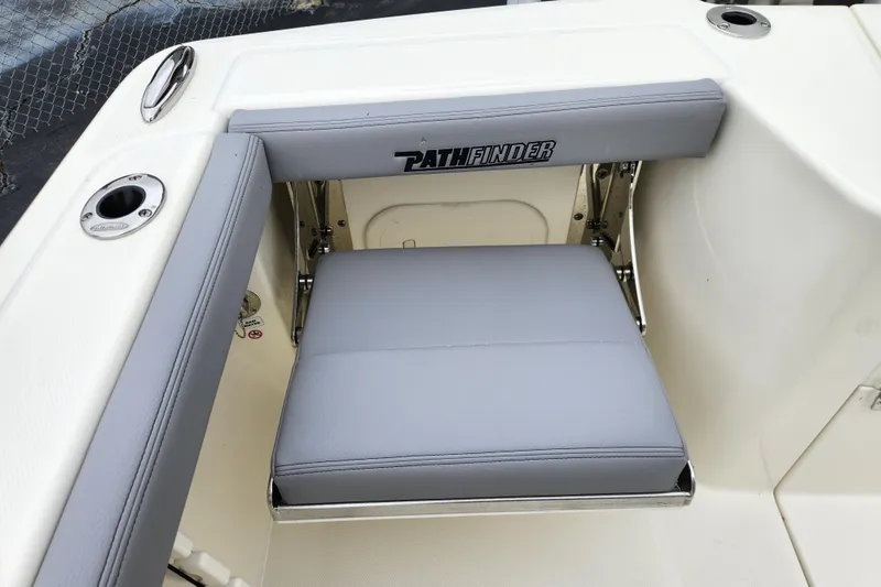 Slide: The Image of 2026 Pathfinder 2400 Open boat seat with gray upholstery and branded logo. - 16