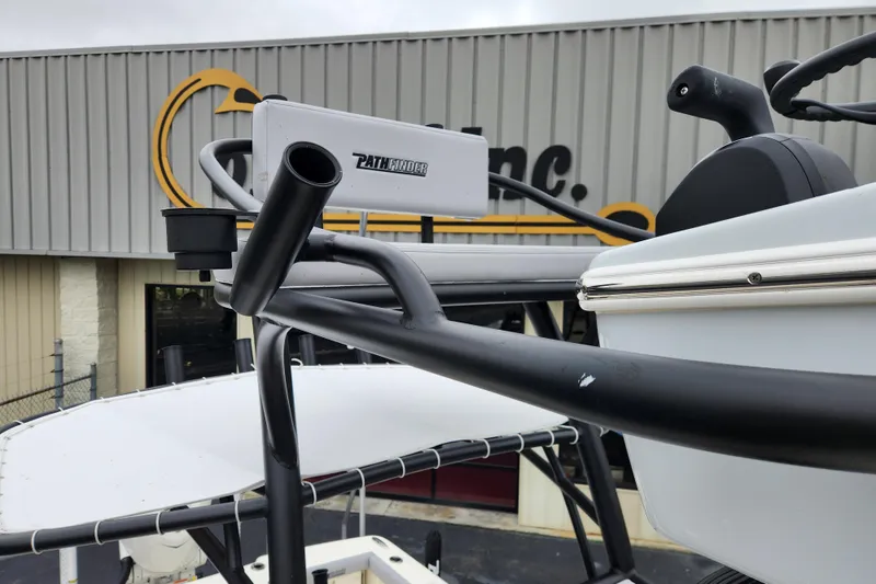Slide: The Image of 2026 Pathfinder 2400 Open boat detail with black railings and equipment, outdoor setting. - 18