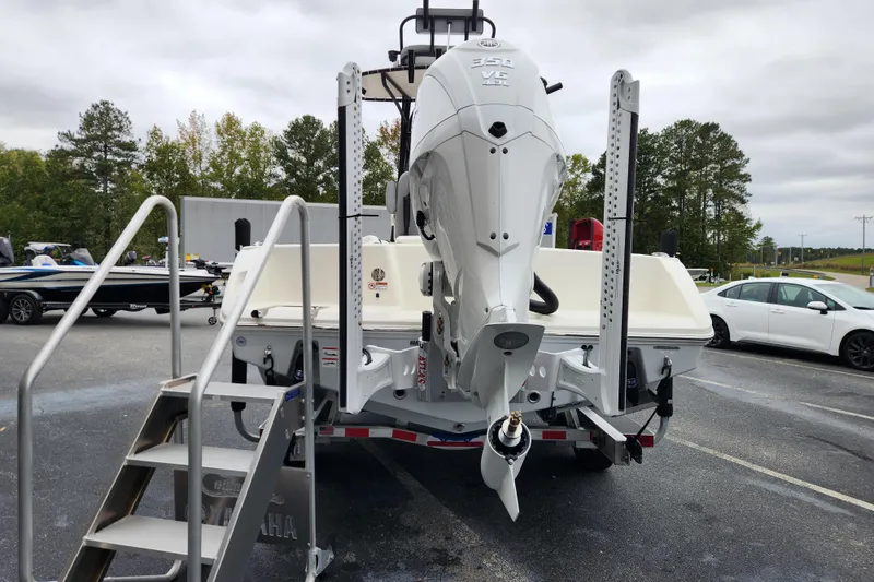 Slide: The Image of 2026 Pathfinder 2400 Open boat with Yamaha 350 V8 engine, parked outdoors. - 3