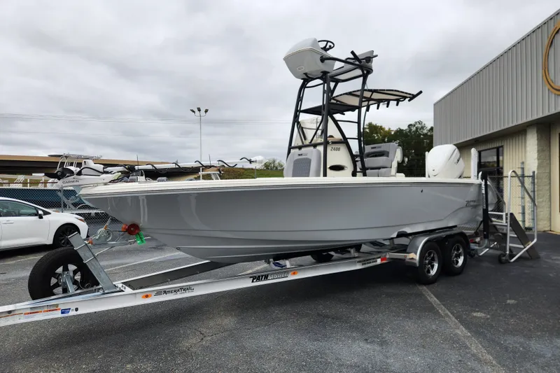 Slide: The Image of 2026 Pathfinder 2400 Open boat on trailer, parked outside a building. - 6