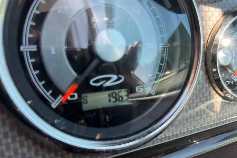 Slide: The Image of Close-up of 2014 Regal 28 Express boat tachometer displaying 196.3 hours. - 25