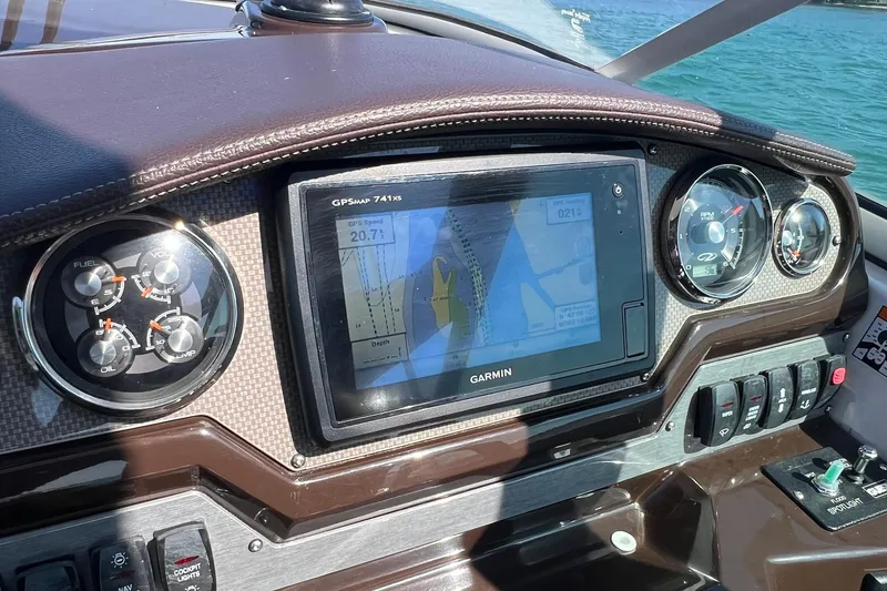 Slide: The Image of Dashboard of a 2014 Regal 28 Express boat with Garmin GPS and gauges. - 26