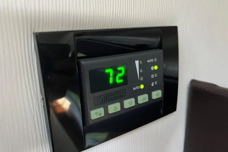 Slide: The Image of Digital thermostat display on 2014 Regal 28 Express boat, showing temperature at 72 degrees. - 32