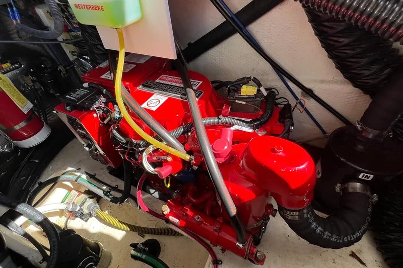 Slide: The Image of Engine compartment of a 2014 Regal 28 Express boat with Westerbeke generator. - 39