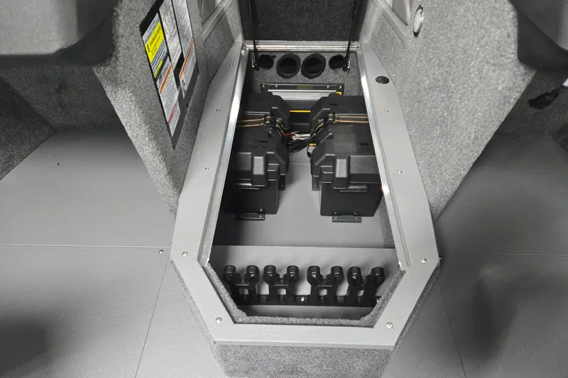 Slide: The Image of 2026 Princecraft Sport 188 boat battery compartment with dual batteries and wiring setup. - 10