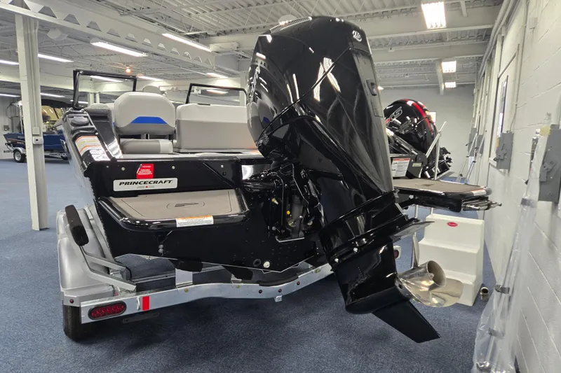 Slide: The Image of 2026 Princecraft Sport 188 boat with powerful outboard motor in showroom. - 3