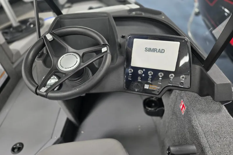Slide: The Image of 2026 Princecraft Sport 188 boat dashboard with steering wheel and Simrad display. - 8