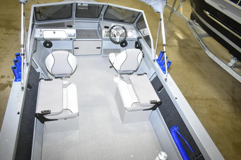 Slide: The Image of Interior of 2026 KingFisher 1825 Falcon boat with modern seating and steering console. - 17