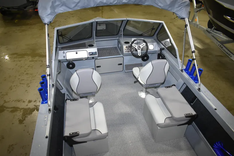 Slide: The Image of Interior of 2026 KingFisher 1825 Falcon boat with seating and steering console. - 18