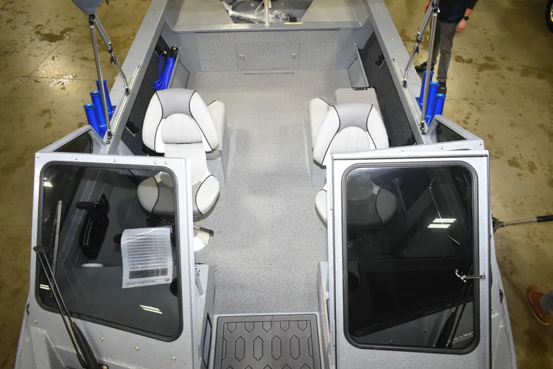 Slide: The Image of Interior view of 2026 KingFisher 1825 Falcon boat with seating and open doors. - 20