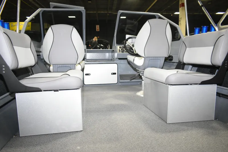 Slide: The Image of Interior of 2026 KingFisher 1825 Falcon boat with modern seating and steering console. - 23