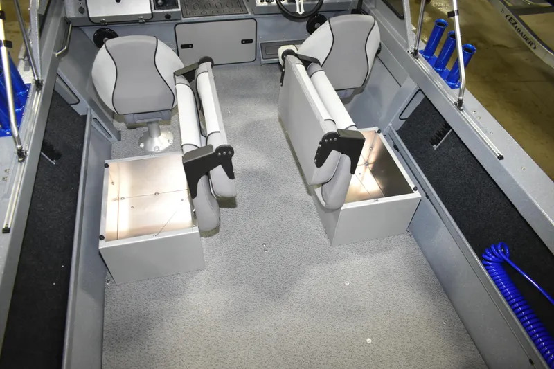 Slide: The Image of Interior of 2026 KingFisher 1825 Falcon boat with seating and storage compartments. - 24