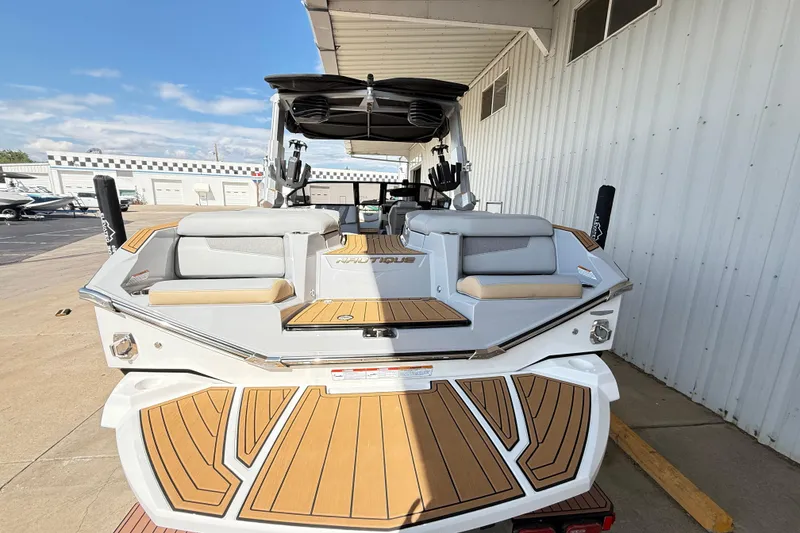 Slide: The Image of 2022 Nautique Super Air Nautique G23 boat with sleek design and spacious seating. - 16