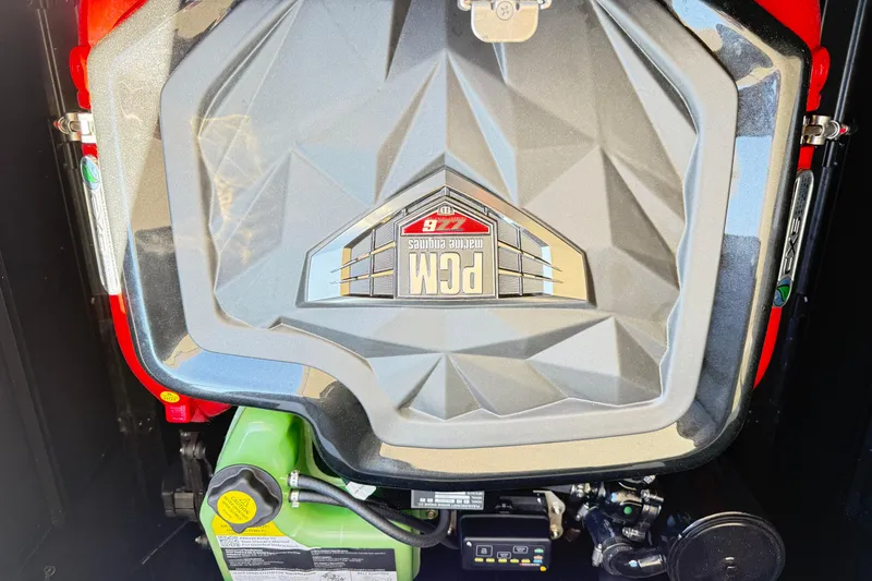 Slide: The Image of 2022 Nautique Super Air Nautique G23 engine compartment with PCM engine cover. - 18