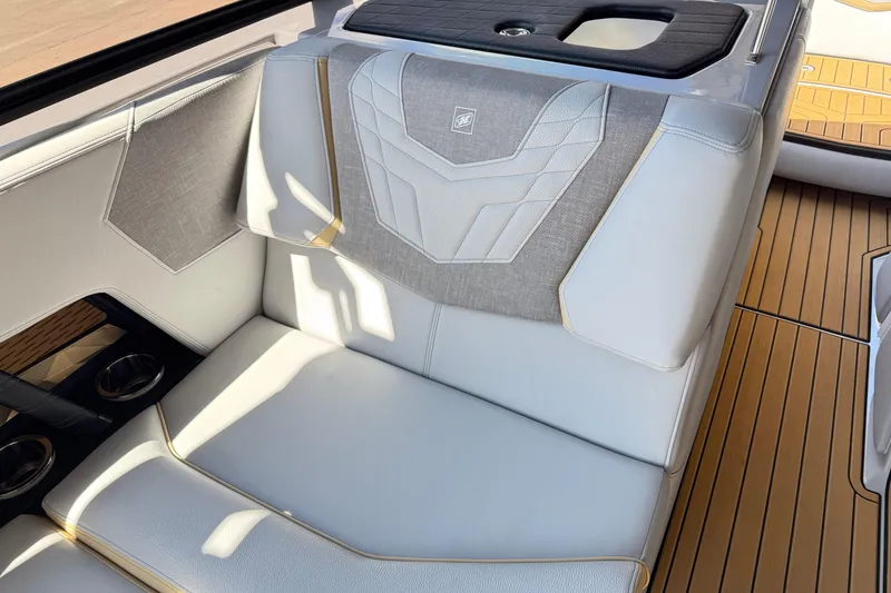 Slide: The Image of 2022 Nautique Super Air Nautique G23 interior seating with elegant upholstery and cup holders. - 20