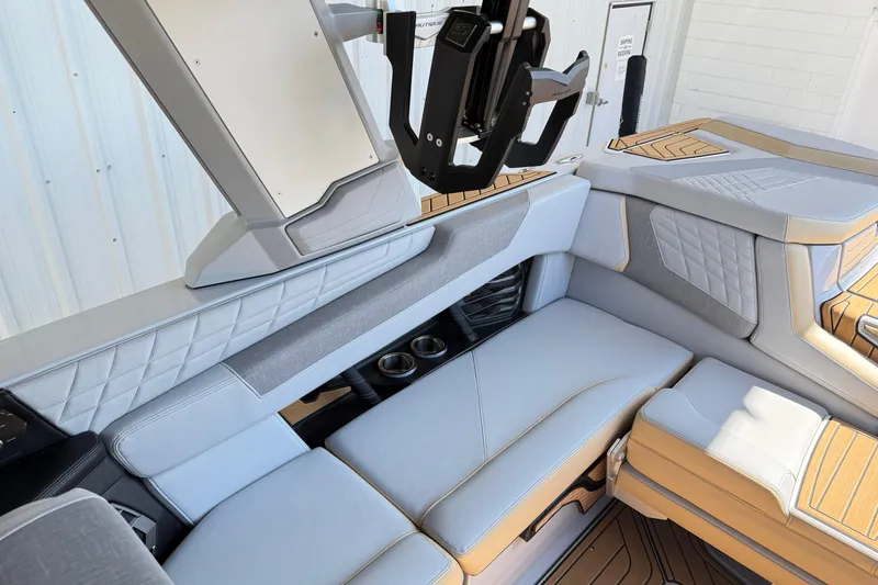 Slide: The Image of Luxurious interior of 2022 Nautique Super Air Nautique G23 boat with plush seating. - 22