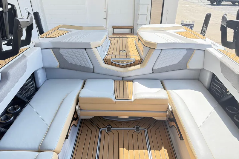 Slide: The Image of Luxurious interior of 2022 Nautique Super Air Nautique G23 boat with plush seating. - 23