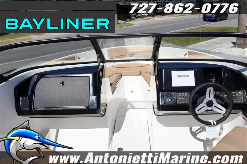 Slide: The Image of 2026 Bayliner V20 boat interior with steering wheel and dashboard, featuring Simrad electronics. - 10