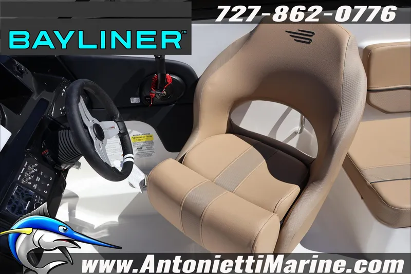 Slide: The Image of 2026 Bayliner V20 boat interior with steering wheel and beige seating at Antonietti Marine. - 17