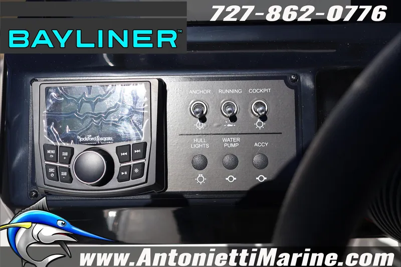 Slide: The Image of 2026 Bayliner V20 dashboard with control panel and audio system, featuring marine switches. - 19