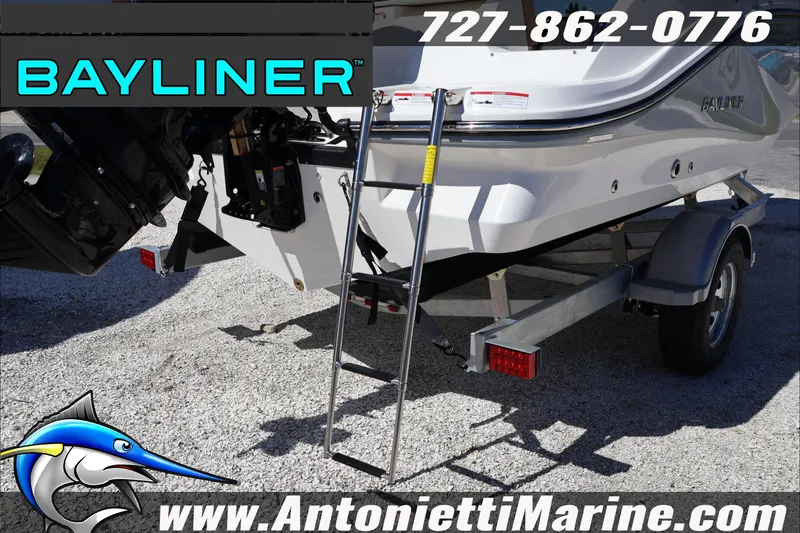 Slide: The Image of 2026 Bayliner V20 boat on trailer at Antonietti Marine dealership. - 6
