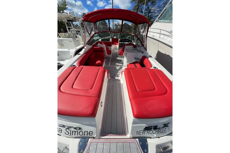 Slide: The Image of 2014 Sea Ray 270 SLX boat with red seating and canopy, docked in New Rochelle, NY. - 12
