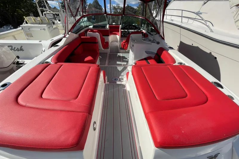 Slide: The Image of 2014 Sea Ray 270 SLX boat with vibrant red seating and sleek design. - 13