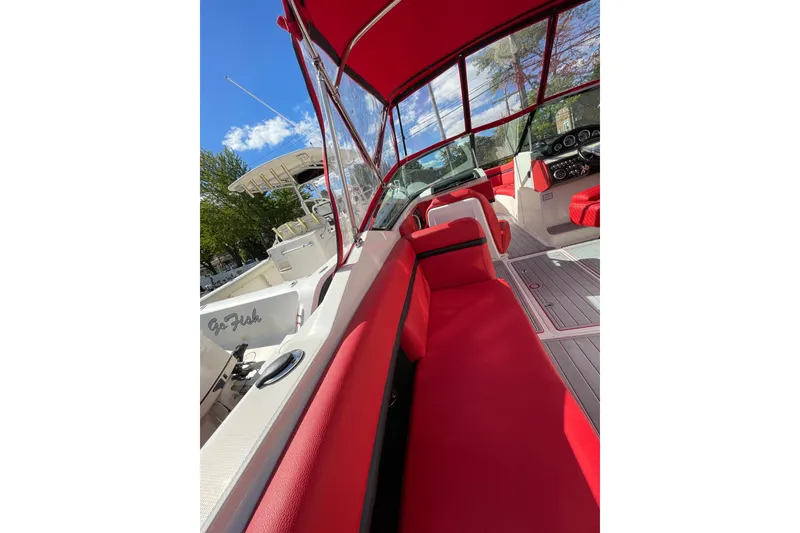 Slide: The Image of 2014 Sea Ray 270 SLX boat with vibrant red interior and sleek design. - 2