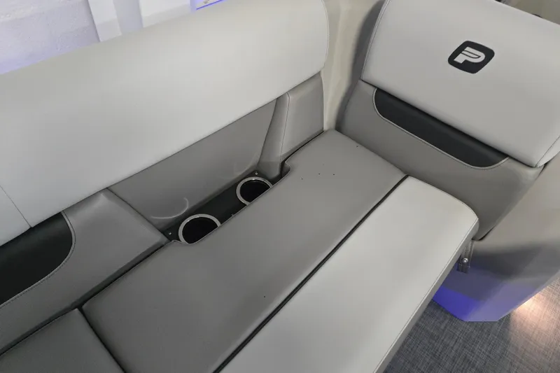 Slide: The Image of 2025 Princecraft Vectra 21 RL boat interior seating with cup holders and logo. - 11