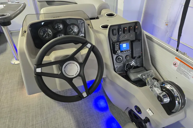 Slide: The Image of 2025 Princecraft Vectra 21 RL boat dashboard with steering wheel and control panel. - 3