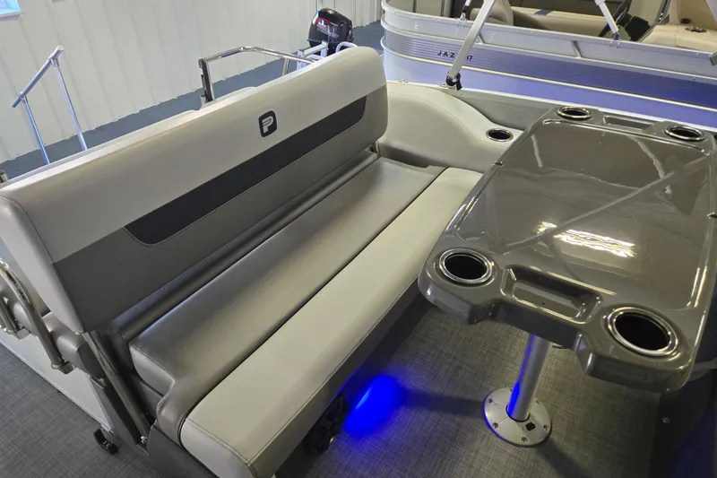 Slide: The Image of 2025 Princecraft Vectra 21 RL interior with gray seating and table, featuring cup holders. - 5