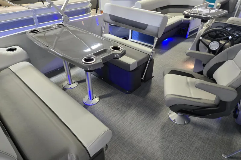 Slide: The Image of 2025 Princecraft Vectra 21 RL interior with seating, table, and steering console. - 6