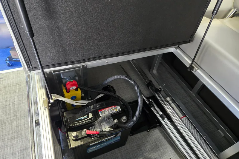 Slide: The Image of 2025 Princecraft Vectra 21 RL boat battery compartment with wiring and hydraulic components. - 8