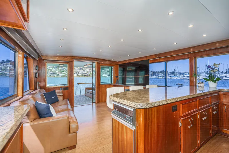 Slide: The Image of Luxurious interior of 1979 Hatteras 58 Motor Yacht with panoramic water views. - 37