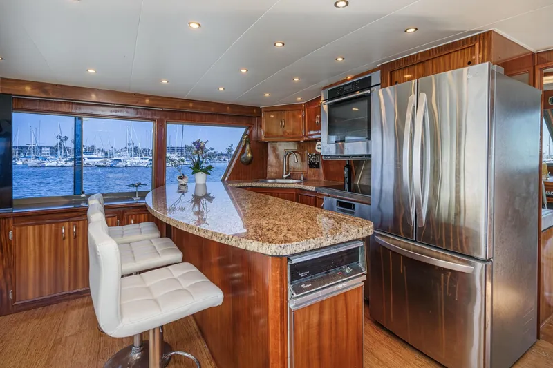 Slide: The Image of Luxurious kitchen interior of 1979 Hatteras 58 Motor Yacht with granite countertops and stainless appliances. - 38