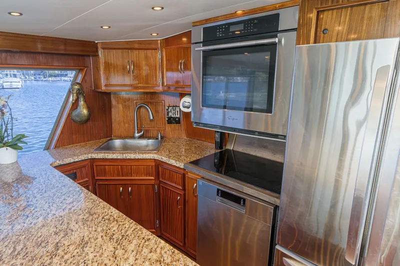 Slide: The Image of Luxurious kitchen interior of 1979 Hatteras 58 Motor Yacht with modern appliances. - 39