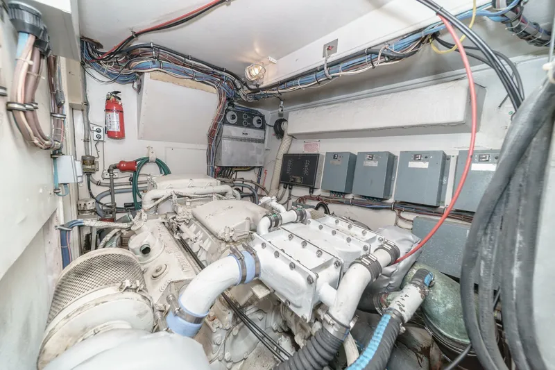 Slide: The Image of Engine room of 1979 Hatteras 58 Motor Yacht with visible wiring and equipment. - 66