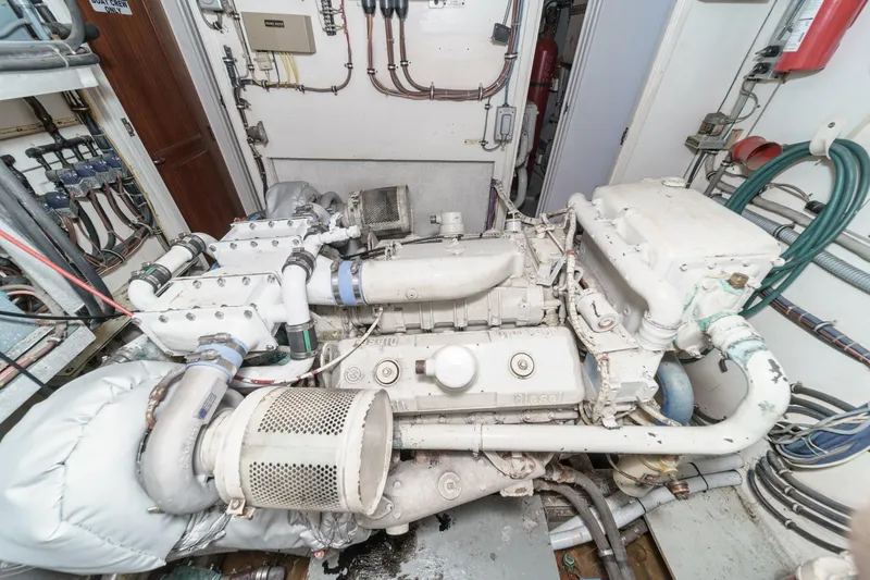 Slide: The Image of Engine room of 1979 Hatteras 58 Motor Yacht with visible machinery and wiring. - 67