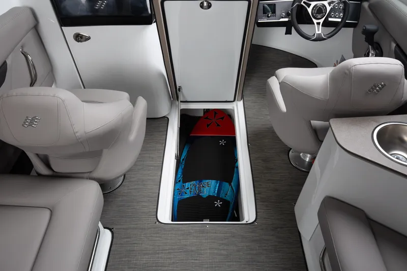 Slide: The Image of 2026 Four Winns HD8 OB boat interior with storage compartment and modern seating. - 16