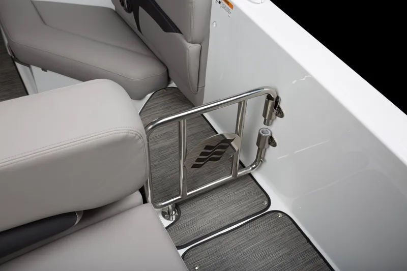 Slide: The Image of 2026 Four Winns HD8 OB boat interior with stainless steel gate and cushioned seating. - 23