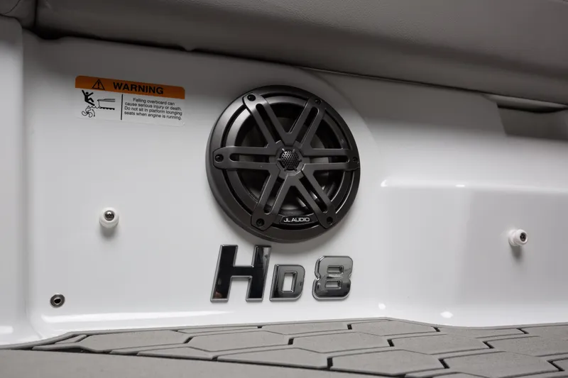 Slide: The Image of 2026 Four Winns HD8 OB boat interior with speaker and warning label. - 25