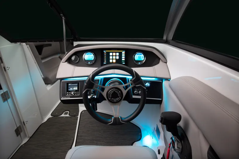 Slide: The Image of 2026 Four Winns HD8 OB boat dashboard with illuminated controls and modern steering wheel. - 26