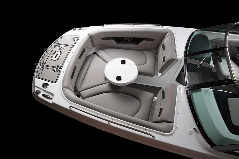 Slide: The Image of Manufacturer Provided Image: 2025 Four Winns HD8 OB boat interior with sleek seating and round table. - 3