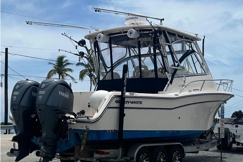The Image of 2007 Grady-White Express 305 boat near ornate waterfront architecture. - 0
