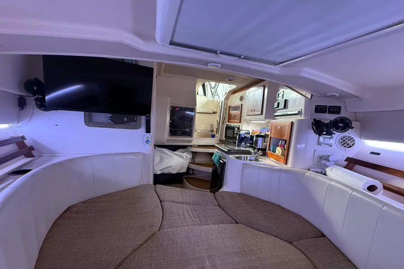 Slide: The Image of Storage compartment on 2007 Grady-White Express 305 boat with tackle boxes and speaker. - 12