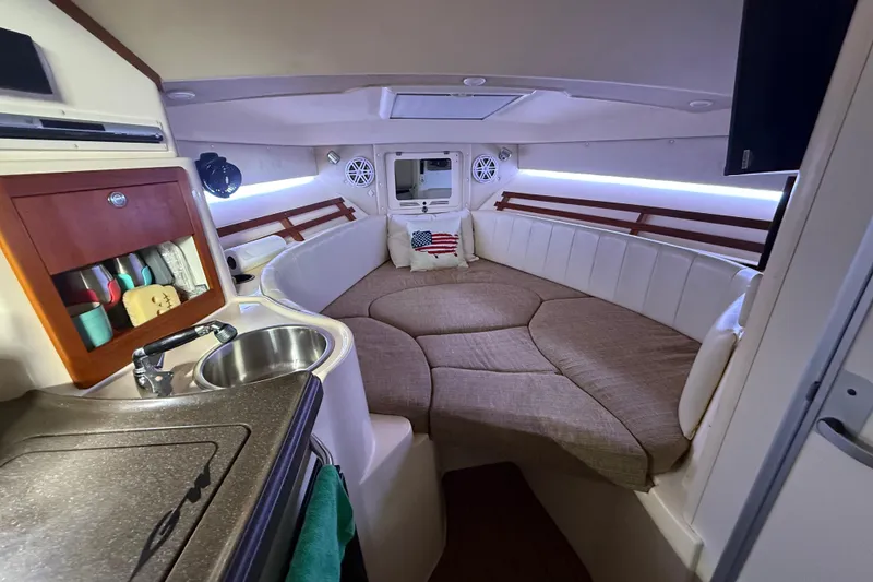 Slide: The Image of Interior view of 2007 Grady-White Express 305 boat cockpit with steering wheel and controls. - 16