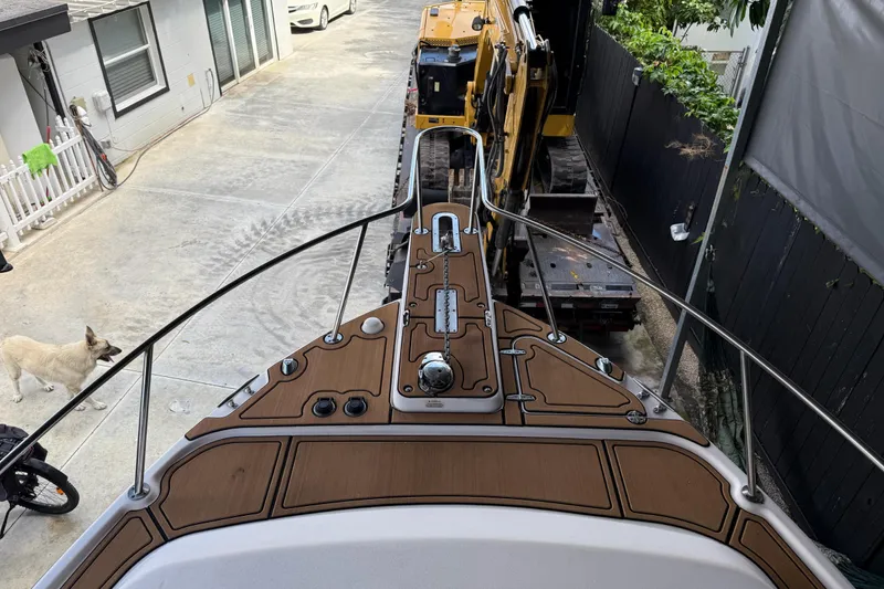 Slide: The Image of 2007 Grady-White Express 305 boat dashboard with navigation and communication equipment. - 17